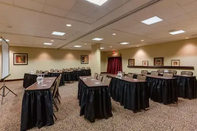 a conference room with tables and chairs in it at Hampton Inn Bennington in Bennington