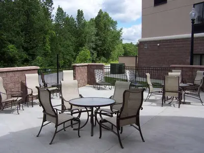 a group of chairs and a table and chairs at Hampton Inn Bennington in Bennington