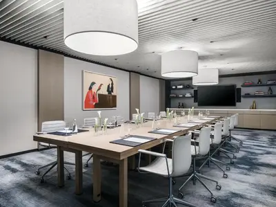 a conference room with a long table and chairs at The Langham, New York, Fifth Avenue in New York