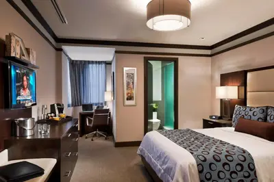 a hotel room with a bed and a desk at The Pearl Hotel in New York