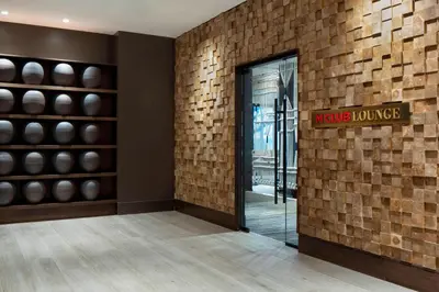 a lobby with a door to a wine house at New York LaGuardia Airport Marriott in Queens