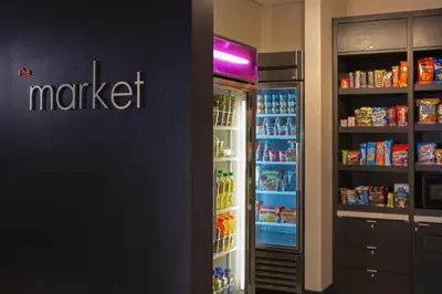 a refrigerator with its door open in a store at Courtyard New York Manhattan/Midtown East in New York