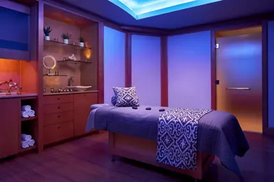 a bedroom with a bed and a sink in it at The Opus Westchester, Autograph Collection in White Plains
