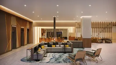 a living room with a couch and chairs at Marriott Springfield Downtown in Springfield
