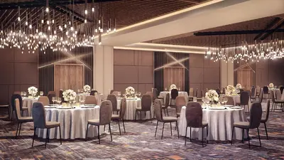 a banquet hall with tables and chairs and chandeliers at Marriott Springfield Downtown in Springfield