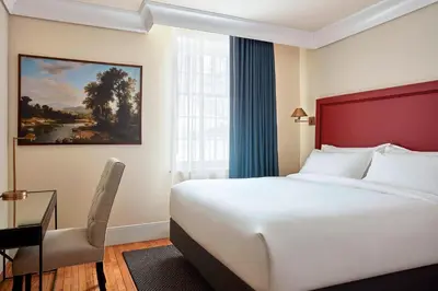 a hotel room with a bed and a window at The Wick, Hudson, a Tribute Portfolio Hotel in Hudson