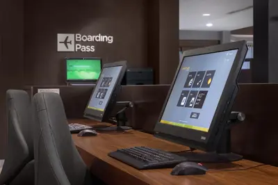 a desk with a computer monitor and a keyboard and mouse at Courtyard by Marriott Mahwah in Mahwah