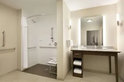 a bathroom with a sink and a shower at Homewood Suites By Hilton Hartford Manchester in Manchester