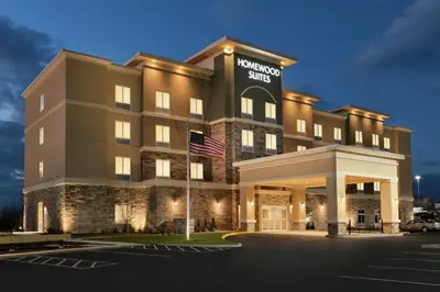 a hotel with an american flag in front of it at Homewood Suites By Hilton Hartford Manchester in Manchester