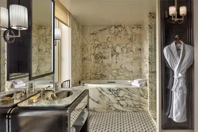 a bathroom with a sink and a bath tub at The Carlyle, A Rosewood Hotel in New York