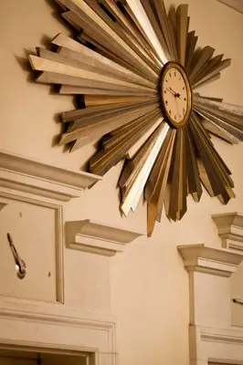 a clock is hanging on a wall at The Carlyle, A Rosewood Hotel in New York