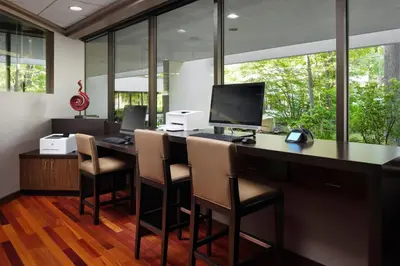 an office with a desk with a computer and chairs at Marriott Park Ridge in Park Ridge