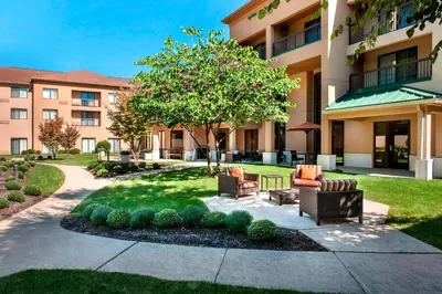 a courtyard with furniture in front of a building at Courtyard Parsippany in Parsippany