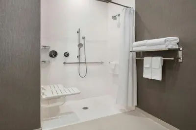 a bathroom with a shower with a shower curtain at SpringHill Suites Danbury in Danbury
