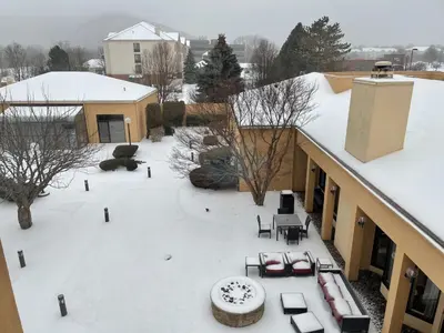 an aerial view of a patio in the snow at Courtyard by Marriott Fishkill in Fishkill