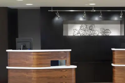 a black wall with drawings on the wall at Courtyard by Marriott Tarrytown Westchester County in Tarrytown
