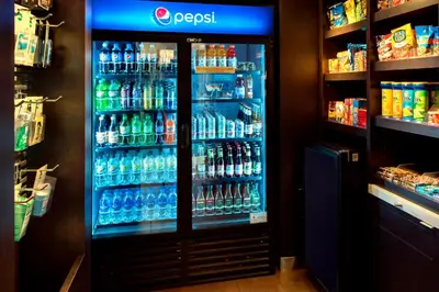 a refrigerator filled with lots of drinks in a store at Courtyard by Marriott Poughkeepsie in Poughkeepsie