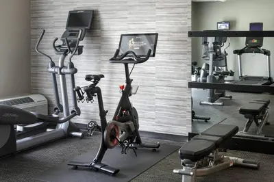 a gym with several tread machines and a treadmill at Courtyard by Marriott Poughkeepsie in Poughkeepsie