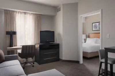 a hotel room with a bed and a television at Residence Inn Poughkeepsie in Poughkeepsie