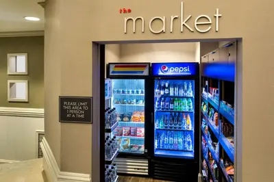 a market refrigerator in a store with drinks at Residence Inn Poughkeepsie in Poughkeepsie