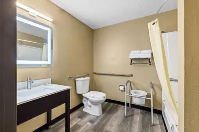a bathroom with a toilet and a sink at Super 8 by Wyndham Amsterdam in Amsterdam