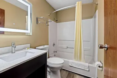 a bathroom with a toilet and a sink and a shower at Super 8 by Wyndham Amsterdam in Amsterdam