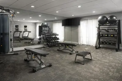 a gym with exercise equipment in a room at Fairfield Inn & Suites by Marriott Newark Liberty International Airport in Newark