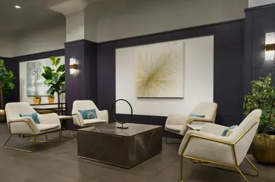 a waiting room with chairs and a table at Courtyard New York Manhattan/Times Square in New York