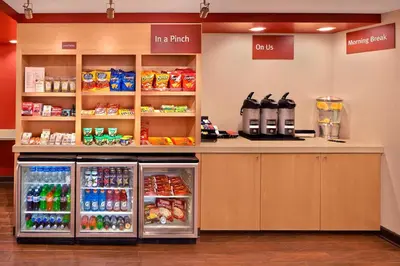a food counter in a store with a refrigerator at TownePlace Suites by Marriott Albany Downtown/Medical Center in Albany