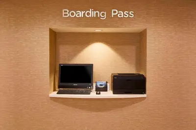 a computer sitting on a shelf in a wall at Courtyard by Marriott Albany Thruway in Albany