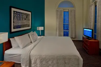 a bedroom with a large bed and a television at Residence Inn by Marriott Hartford Downtown in Hartford