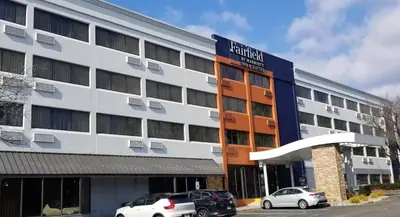 an office building with cars parked in front of it at Fairfield Inn & Suites Parsippany in Parsippany