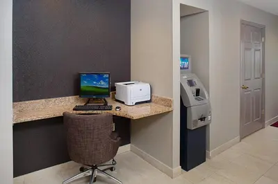a room with a desk with a computer and a printer at Residence Inn by Marriott Saddle River in Saddle River