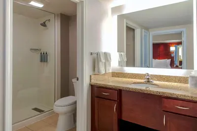 a bathroom with a toilet and a sink and a shower at Residence Inn by Marriott Yonkers Westchester County in Yonkers