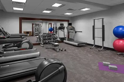 a gym with treadmills and exercise equipment in a room at Residence Inn White Plains Westchester County in White Plains
