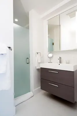 a bathroom with a sink and a mirror at Station Inn Pawling in Pawling