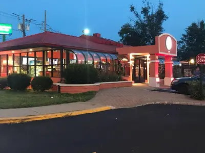 a building with a stop sign in front of it at Days Inn by Wyndham Nanuet / Spring Valley in Nanuet