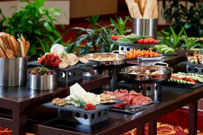 a buffet with different types of food on a table at Marriott Hartford/Windsor Airport in Windsor