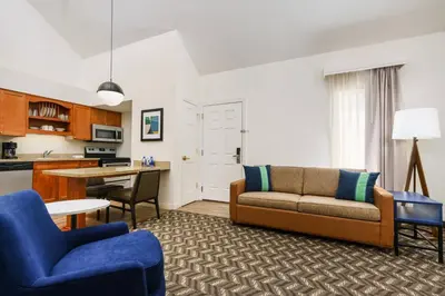 a living room with a couch and a table at Residence Inn by Marriott Hartford Windsor in Windsor