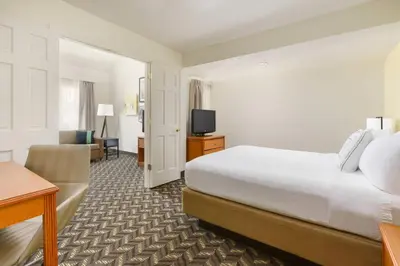 a hotel room with a bed and a television at Residence Inn by Marriott Hartford Windsor in Windsor