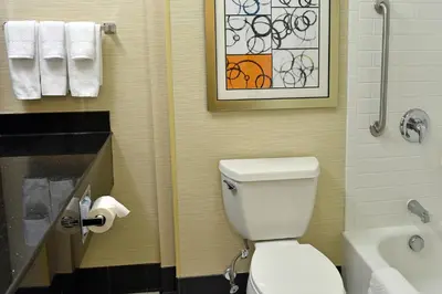 a bathroom with a toilet and a sink at Fairfield Inn Hartford Airport in Windsor Locks