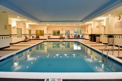 a pool in the middle of a hotel at Fairfield Inn Hartford Airport in Windsor Locks