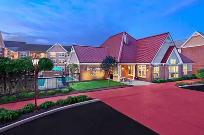 a house with a red roof and a driveway at Residence Inn Hartford Avon in Avon