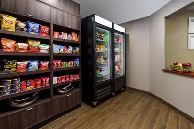 a room with a refrigerator and lots of food at Residence Inn Hartford Rocky Hill in Rocky Hill