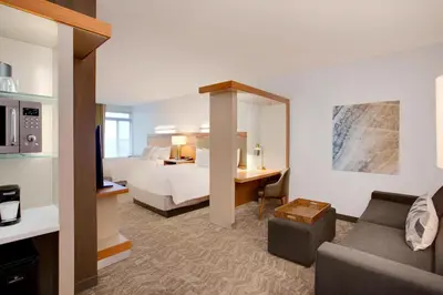 a hotel room with a bed and a desk at SpringHill Suites Hartford Airport/Windsor Locks in Windsor Locks