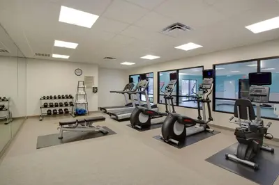a gym with treadmills and elliptical machines at SpringHill Suites Hartford Airport/Windsor Locks in Windsor Locks