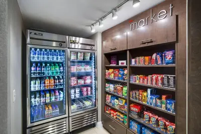 a refrigerator filled with lots of drinks and soda at Residence Inn Milford in Milford