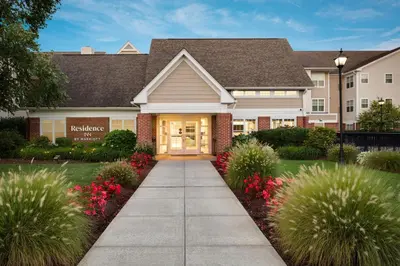 a house with a sidewalk in front of it at Residence Inn Milford in Milford