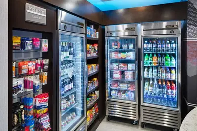 a refrigerator filled with lots of different types of drinks at SpringHill Suites Milford in Milford