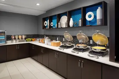 a kitchen with a counter with pots and pans at SpringHill Suites Milford in Milford